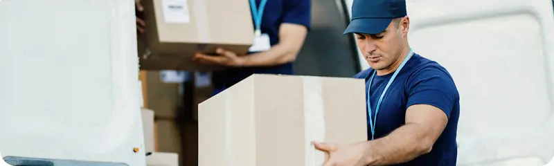 young-delivery-man-carrying-package-reading-address-label-his-customer-is-standing-background-2