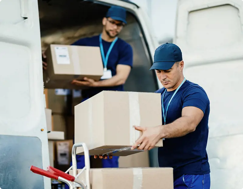 young-delivery-man-carrying-package-reading-address-label-his-customer-is-standing-background